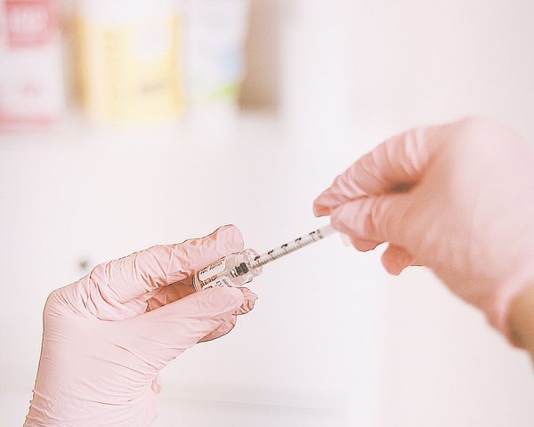 Injector being prepared before the treatment — illustrative image